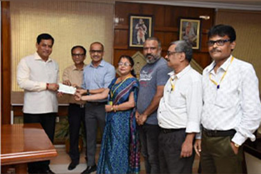 NIC Assam officials handing over cheque for flood relief to Hon’ble Chief Minister of Assam